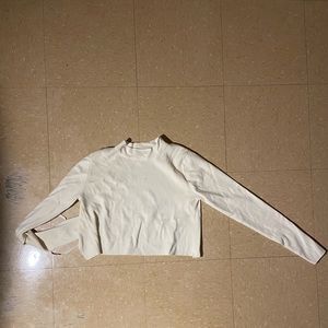 White open-back long sleeve top